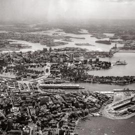 Aerial of Sydney CBD and harbour from Elizabeth Bay, 1960s