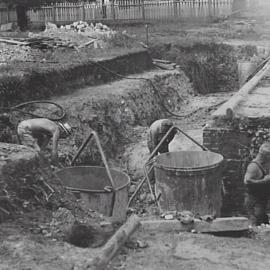 Men involved in excavation operations