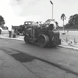 Laying asphalt road surface