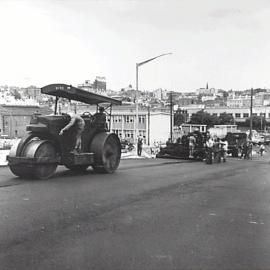 Laying asphalt road surface