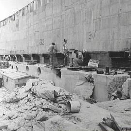 Men working on concrete wall for Cahill Expressway