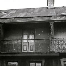 Front façade of a terrace with damaged balcony, Caroline Street Redfern, 1952