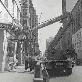 Claude Neon mobile hoist platform on Clarence Street Sydney, 1964