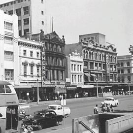 Stores on George Street opposite Sydney Town Hall, 1960