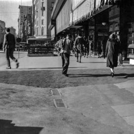 Repairs to George Street footpath, intersection of George and Park Streets Sydney, circa 1930