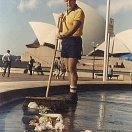 Council worker sweeping rubbish