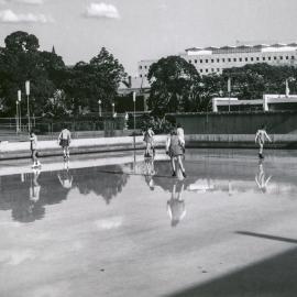 School girls ice skating at Prince Alfred Park ice rink, Chalmers Street Surry Hills, circa 1969