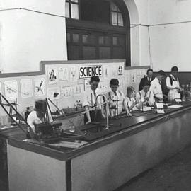 Boys performing chemistry experiments