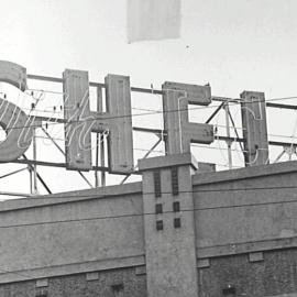 Shell top hamper advertising sign, unknown location, 1959