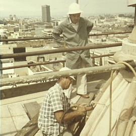 Contractors restoring clock tower sandstone