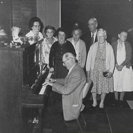 Senior citizens playing the piano