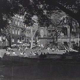 Lunchtime crowd, Macquarie Place Park, circa 1960s