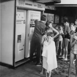 Children lining up for cold drinks, Municipal Baths Woolloomooloo Bay, 1950s