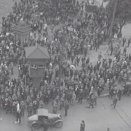 Crowds gathering in Hyde Park at the corner of Park Street and Elizabeth Street Sydney, 1930s