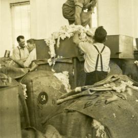 Men working with wool bales