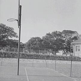 Basketball hoop and court at Moore Park Playground