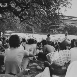 Students gathered in Victoria Park near University of Sydney Fisher Library, 1980s