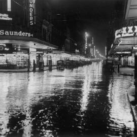 View looking along Pitt Street at night, 1940s