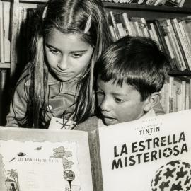 Children reading Tintin in Spanish at the Surry Hills Branch Library, Crown Street Surry Hills, 1956