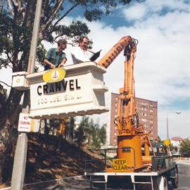 Council workers carrying out a noise survey in a cherry picker truck.