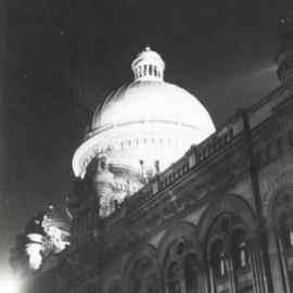 Queen Victoria Building (QVB) at night with floodlit dome, circa 1950's