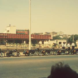 Motorcycles parked outside the City Bowling Club for the Waratah Festival Parade, circa 1950s