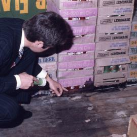 Health inspector checks food storage conditions