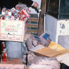 A health inspector checks a food storage area