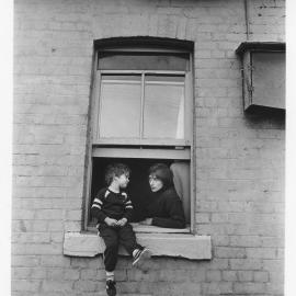 Woman and child in window, Pyrmont, 1988