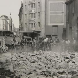 Workers using drills to break up footpath, Hay Street Haymarket, 1948