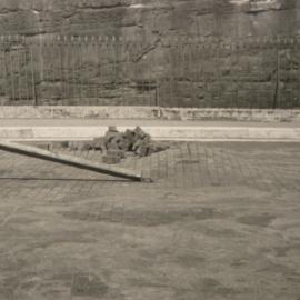Damage to wooden blocks in road surface