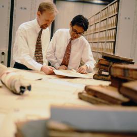 Archives staff examining records, 1996
