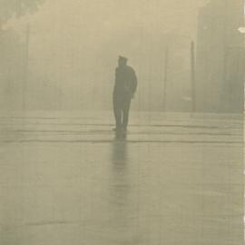 Silhouette of man walking in street, circa 1932