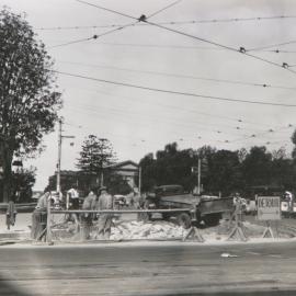 Streetscape and roadworks near Hyde Park, circa 1940-1949