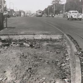 Streetscape and damage to road near Hyde Park, circa 1940-1949