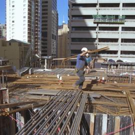 Lobana House (Rialto Apartments), Pitt Street Sydney showing workmen carrying steel rods, 2003