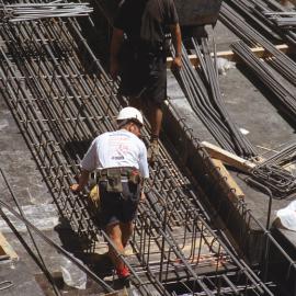 Lobana / Rialto Apartments Construction, Pitt Street Sydney showing workmen and piles of steel, 2002