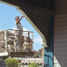 Painter working on exterior of Woolloomooloo Finger Wharf Redevelopment, 2000