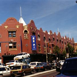 Even more finely restored facade and cars everywhere.