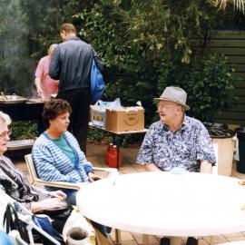 Group of pensioners at a sausage sizzle.