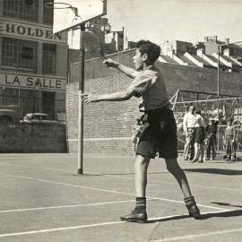 Paddle bat tennis game at Woolloomooloo Children's Playground, Dowling Street Woolloomooloo, 1951