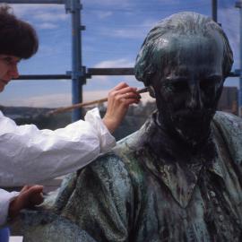 Conservator working on the Shakespeare Memorial, Shakespeare Place Sydney, no date