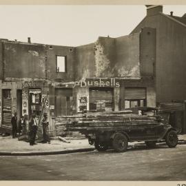 Print - Corner shop demolition in Liverpool Street Darlinghurst, 1931