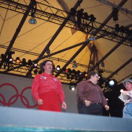 Topp Twins, Mikey Robbins and the Sandman on stage at the Domain Olympic Live Site, Sydney, 2000