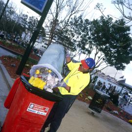 Council cleansing staff emptying garbage bin at Circular Quay West Sydney, 2000