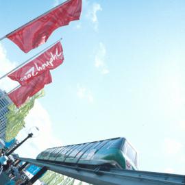 People, flags and the monorail on Pyrmont Bridge, Darling Harbour, Sydney, 2000