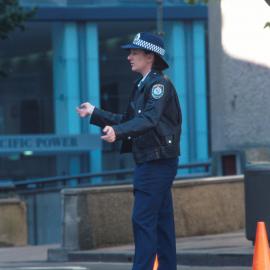 Police giving traffic directions at Men's marathon, Bathurst Street Sydney, 2000