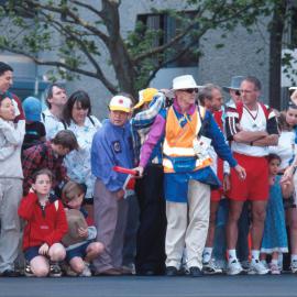 Spectators and Olympic volunteers watching the Men's Marathon, Bathurst Street Sydney, 2000