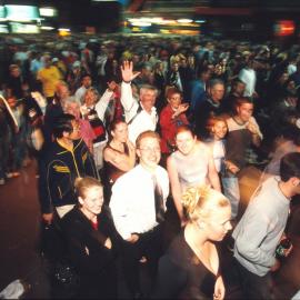 Crowds leaving Circular Quay along George Street after the closing ceremony fireworks Sydney, 2000 