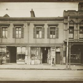 Print - Newsagent and shops in William Street Darlinghurst, 1916